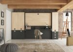 Folding bunk bed with table in front and cupboards