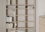 Studio with 90 x 190 horizontal folding bed and bookcase.