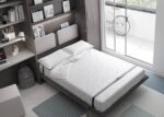 Bedroom with a vertical folding double bed and study area. - Image 2