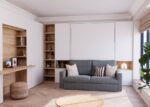 Living room with fold-down bed, sofa and desk