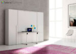 Folding double bed with integrated table
