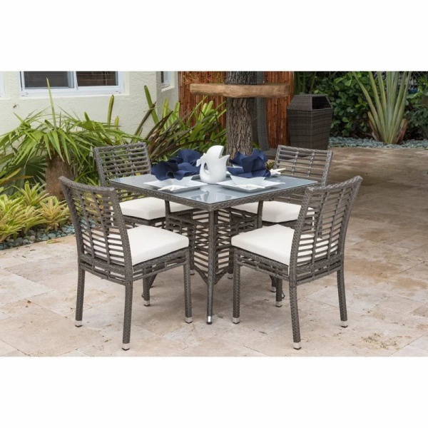 Luckman rattan dining set, 4 chairs and a table