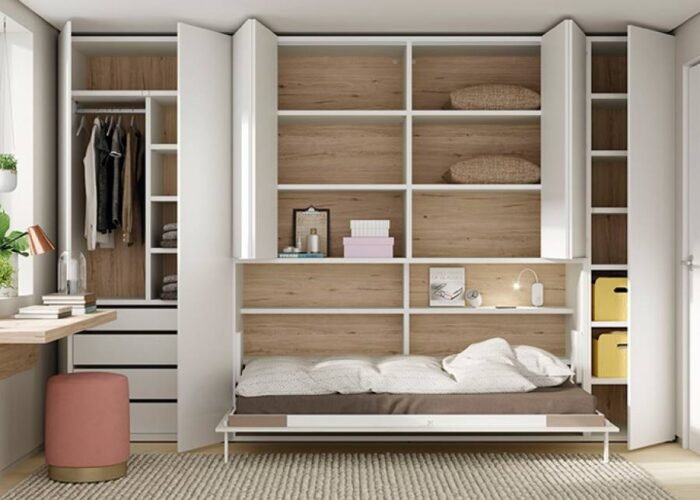 U+D series horizontal folding bed inserted in an asymmetric bookcase with extendable table - Image 1