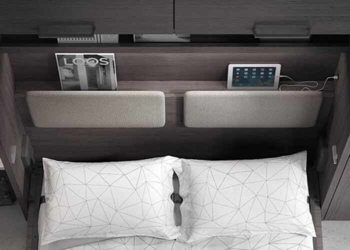 Bedroom with a vertical folding double bed and study area. - Image 3